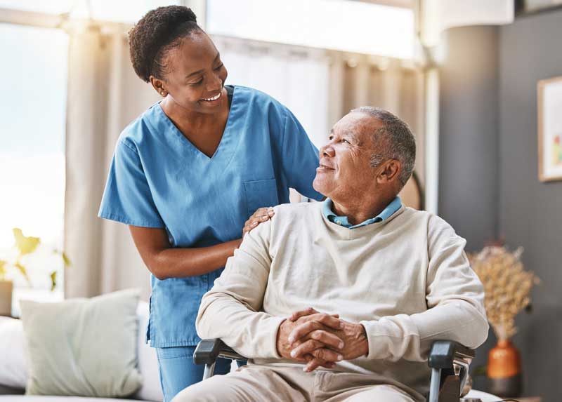 Young nurse attending to elder patient